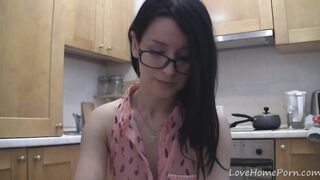 Splendid teen with glasses chatting in the kitchen