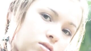 Cute teen plays with cunt in outdoor scene