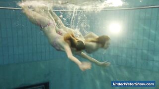 Horny girls strip eachother in the pool
