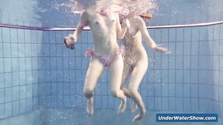 Horny girls strip eachother in the pool