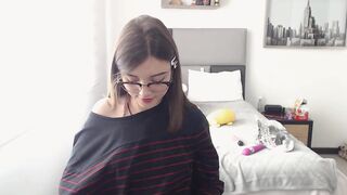 Cute nerdy Colombian girl pulls down her jeans and panties