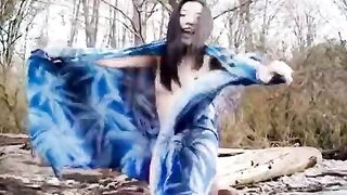 Asian slut is on the beach naked posing