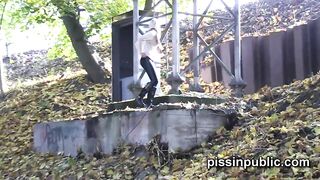 Daring girls pee on the frequented pathway and are seen