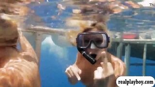 Hot babes in shark cage and snowboarding