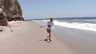 Teen lesbo fingered on the beach