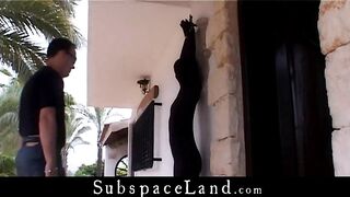 Slave in black suit hundcuffed for bondage fantasy