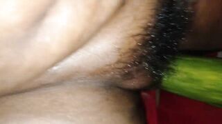put a long cucumber inside the pussy
