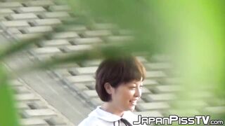 Two girls get caught pissing and filming each other outside