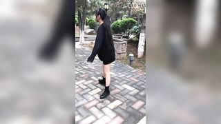 Chinese Girl Walking in a Park