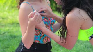 Hot raver chick in see-thru leggings and bra in the park