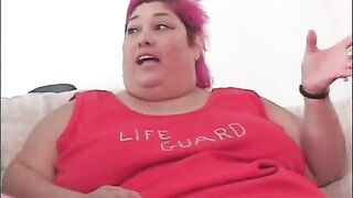 Fat bellied chick in red uniform Zazie Jeanette rides one long stick
