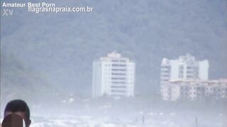 Shameless couple try to have sex on the beach without attracting attention