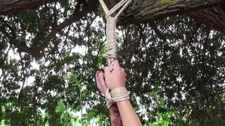 Stripped for a heavy outdoor whipping
