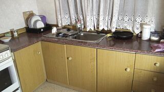 This young girl is stuck in the kitchen