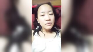 Asian girl bored to be at home alone playing with fruit