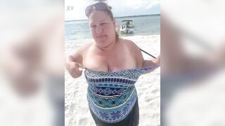 Slutty Bbw duca wife flashes her big tits on a public beach