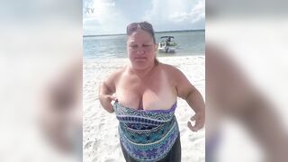 Slutty Bbw duca wife flashes her big tits on a public beach