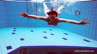 Dressed Croatian cutie Martina swims and strips