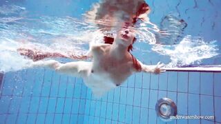 Dressed Croatian cutie Martina swims and strips
