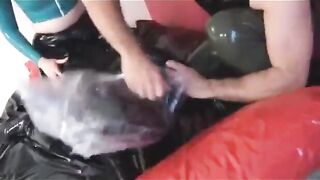 Slave gets fucked in a heavy latex and b.