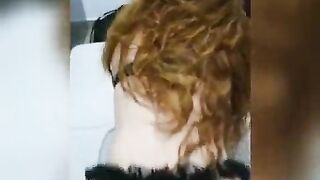 redhead on all fours sitting with