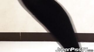 Asian cutie lifts her skirt up to show how she pees