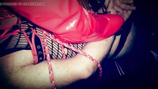 Trampling with red latex boots
