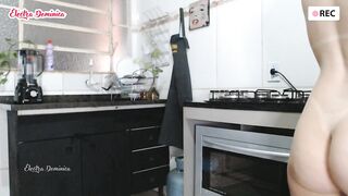Naked maid cleaning the kitchen