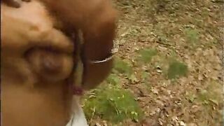 Naughty blonde makes video in the bush, masturbating!