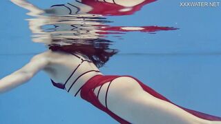 Petite Russian Marfa swims nude in the pool