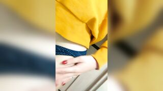 Home daytime striptease in a yellow hoodie. Close-up