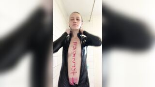 Hot blonde slut strips out of latex cat suit in shower