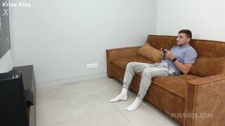 Playing with his dick while he plays Playstation