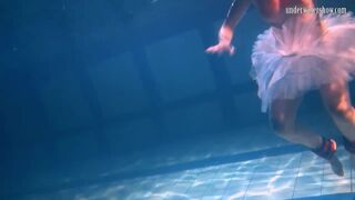 Bulava Lozhkova with a red tie and skirt underwater