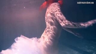 Bulava Lozhkova with a red tie and skirt underwater