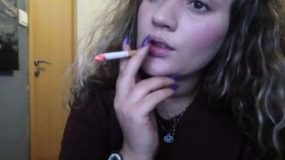 CLOSE-UP CIGAR SMOKE BY A SEXY BLONDE WOMAN