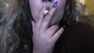 CLOSE-UP CIGAR SMOKE BY A SEXY BLONDE WOMAN