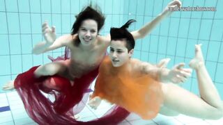 Two hotties submerged underwater