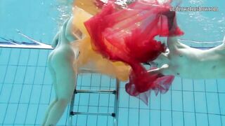 Two hotties submerged underwater