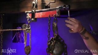 Shaved slave in cage with massive ball gag