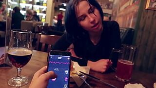 I took control of my stepsister's vibrator in the bar and brought her to orgasm.