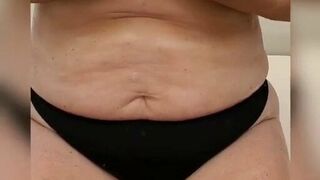 Wife rubs oil on her boobs on a boat