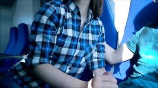 girl in glasses sucks on a train