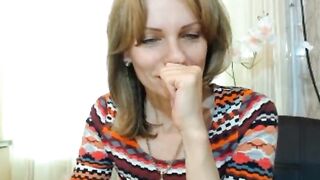 Mommy fingering at home in the kitchen on camera.