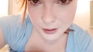 Busty redhead masturbating.