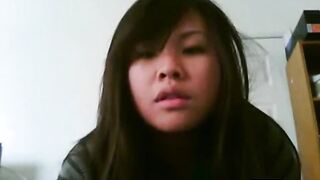 cute asian girl films herself cumming