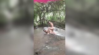 Fucking the bitch in the rainstorm at the waterfall