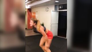 tall fitness instructor shows off her body