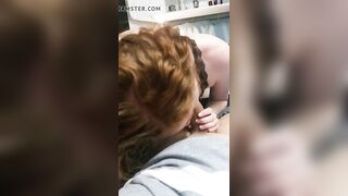 Gorgeous redhead blowing her boyfriend