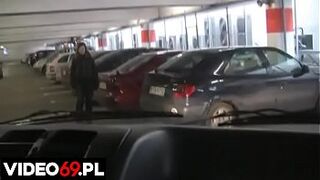 A h. girl gives a blowjob in car on the parking lot of a shopping mall